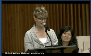 Ashton Applewhite holding her keynote speech at the UN