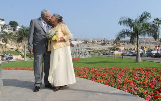 mature couple, walking in park, kissing